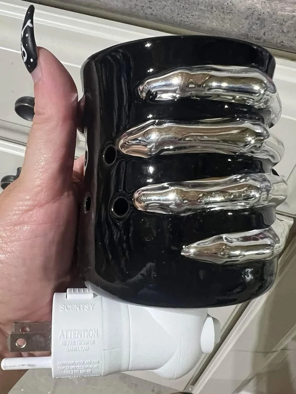 Scentsy Black Ceramic Plug-In Warmer with Silver Skelton hand Accents